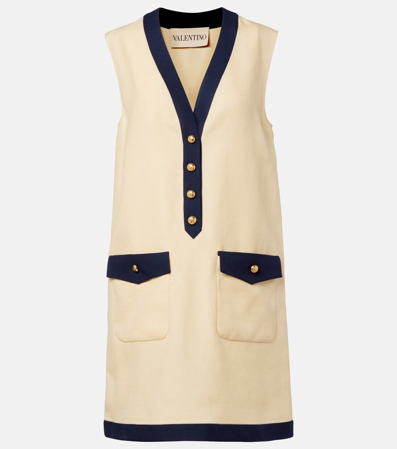 Cream sleeveless dress with navy trim and pockets