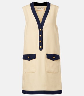Cream sleeveless dress with navy trim and pockets