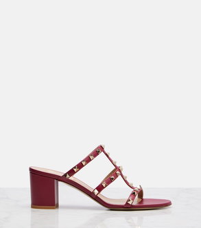Burgundy Valentino Garavani studded leather mules with a stacked block heel.