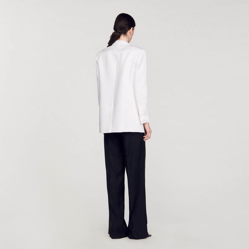 Sandro white blazer with black trousers