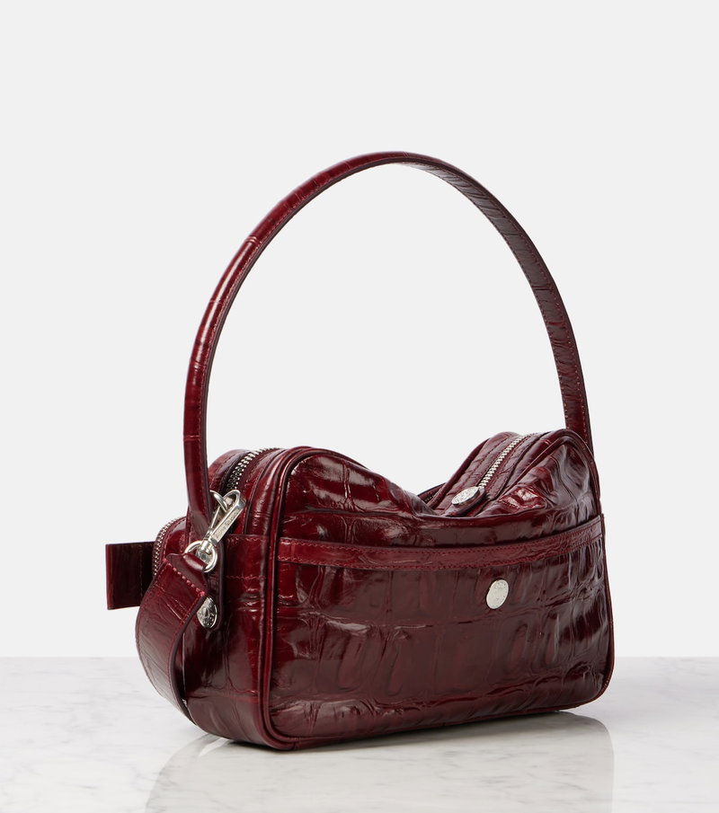 Crimson crocodile-embossed shoulder bag with silver hardware.
