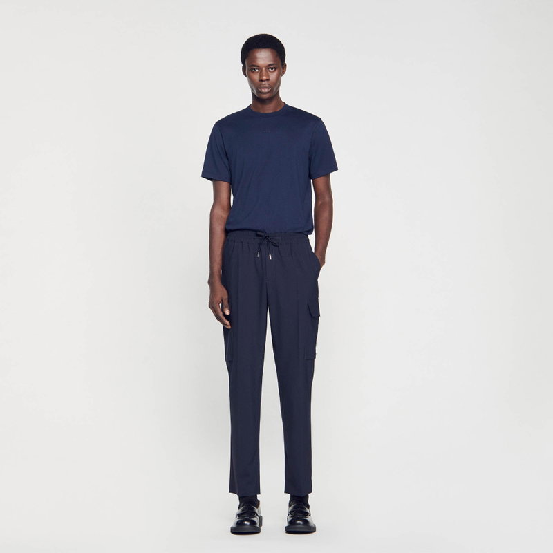 Sandro - Man in navy t-shirt and trousers
