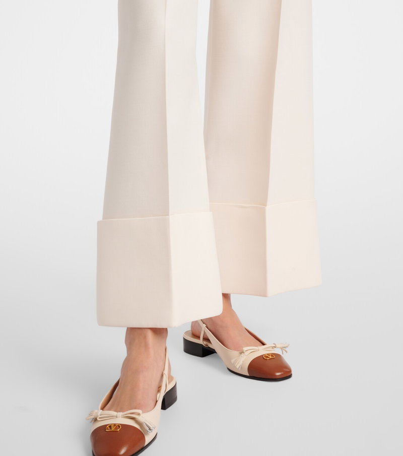 Valentino wide-leg trousers with gold hardware and sandals