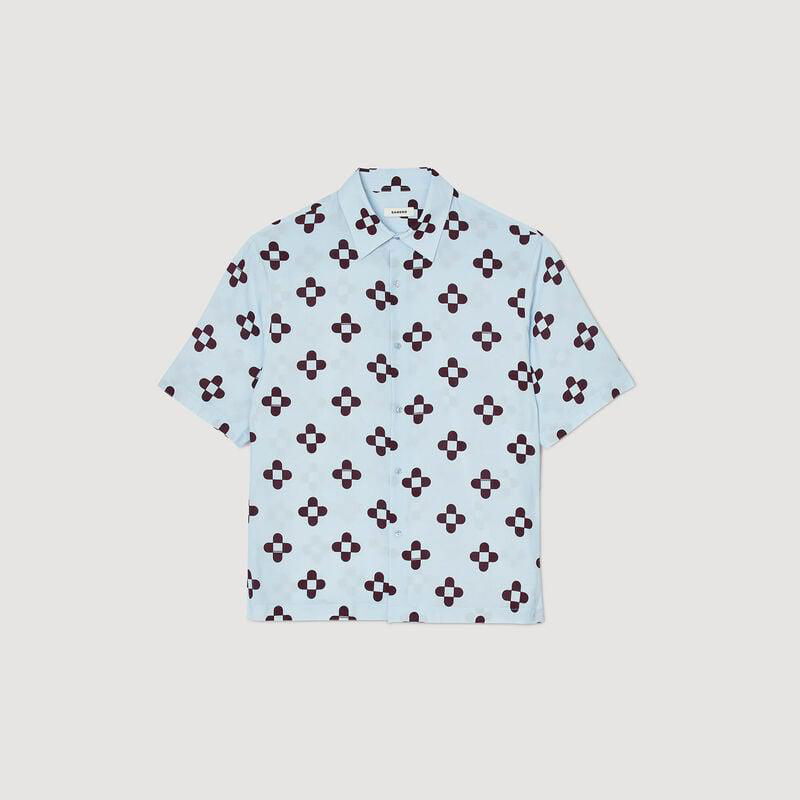 Light blue silk shirt with a dark floral print.