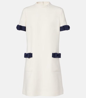 White dress with navy ribbon detailing