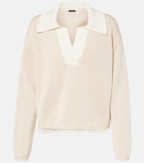 Cream-colored, ribbed knit sweater with a stand-up collar.