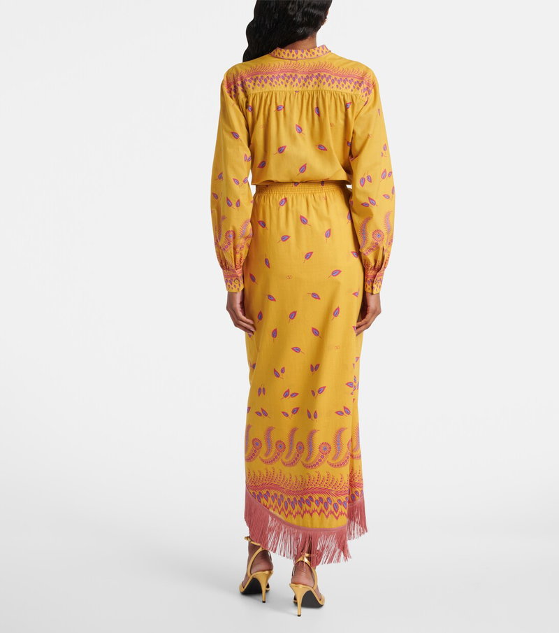 Valentino yellow silk dress with floral embroidery and fringed hem.