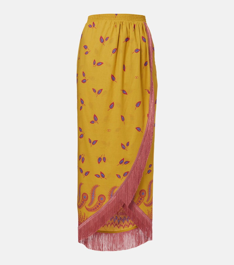 Valentino mustard skirt with floral embroidery and a red fringe hem.