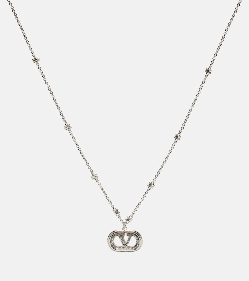 Silver Valentino necklace with a circular pendant featuring the brand's logo.