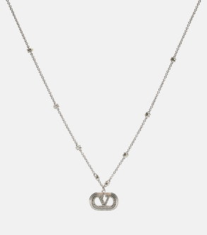 Silver Valentino necklace with a circular pendant featuring the brand's logo.