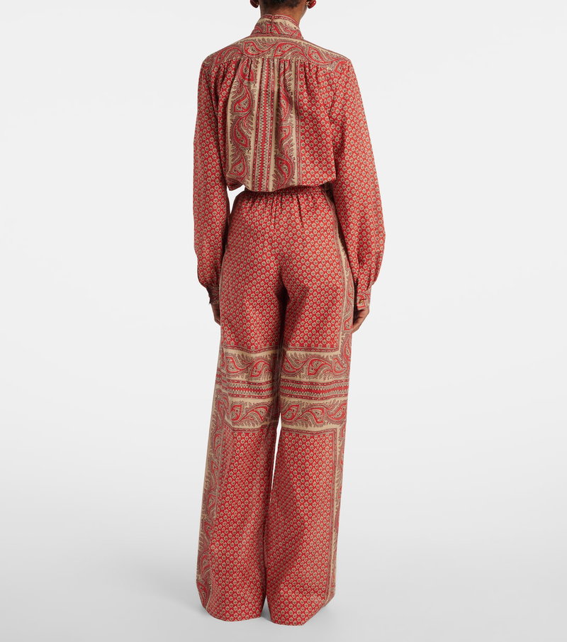 Red paisley jumpsuit with long sleeves
