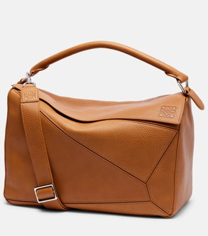 Tan leather hobo bag with geometric Loewe knot detail.