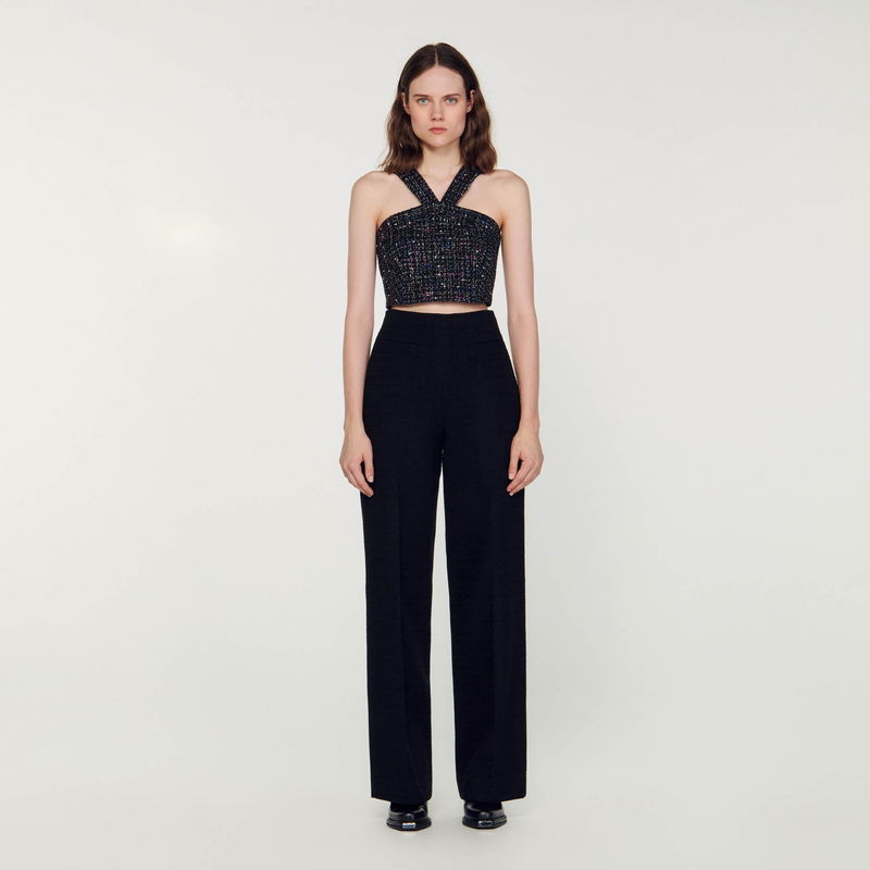 Black tweed halter top and wide-leg trousers.
