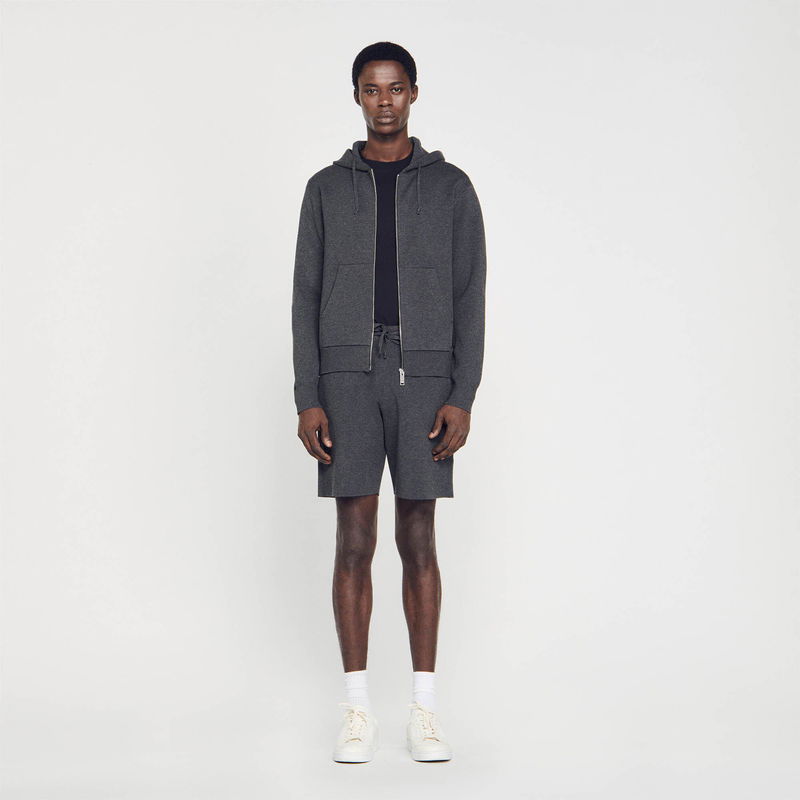Dark gray SANDRO hoodie and shorts outfit on a man
