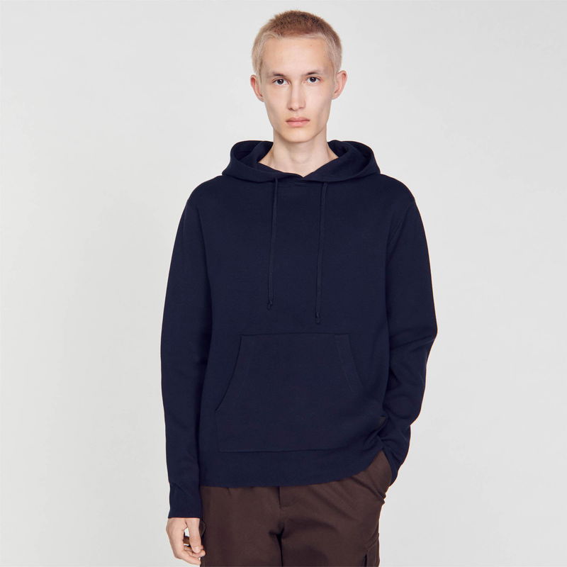 Navy hooded sweatshirt worn by a model.