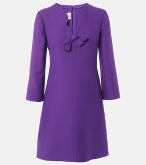 Purple velvet dress with a bow neckline