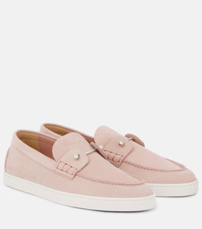Pink suede loafers with pearl accents and white soles.