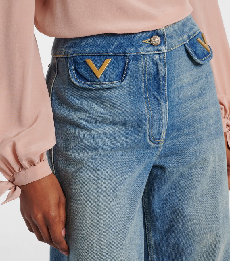 Valentino denim jeans with gold V pockets.