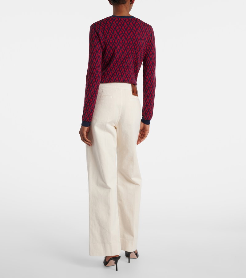 Valentino red and navy diamond-patterned sweater with wide-leg trousers