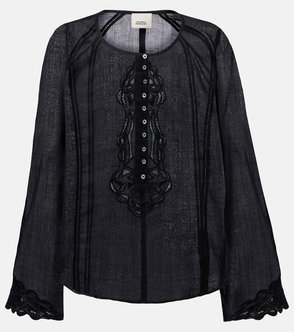 Black linen blouse with lace detailing and ruffled sleeves.