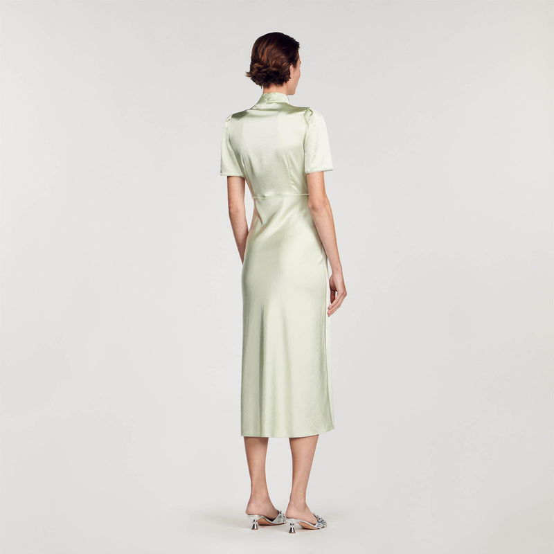 Pale green satin midi dress with a wrap front.