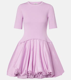 Purple ribbed knit top with a voluminous, tiered skirt.