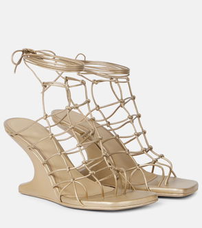 Gold-toned, lacework-detailed heeled sandals with tied straps.