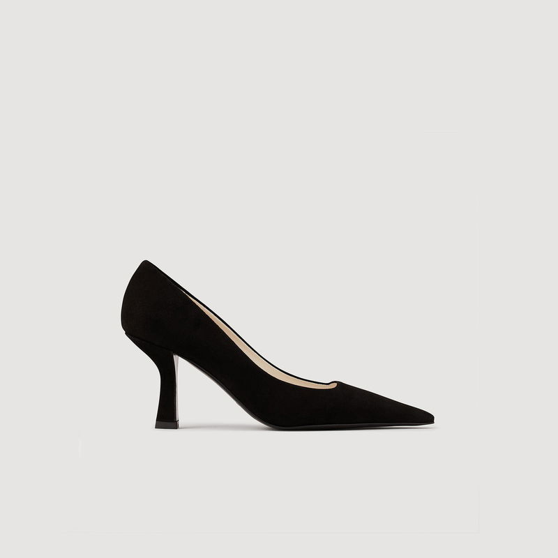 Black suede pump heel on a light background