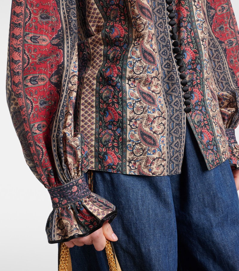 Valentino paisley blouse with black buttons and ruffled sleeves.