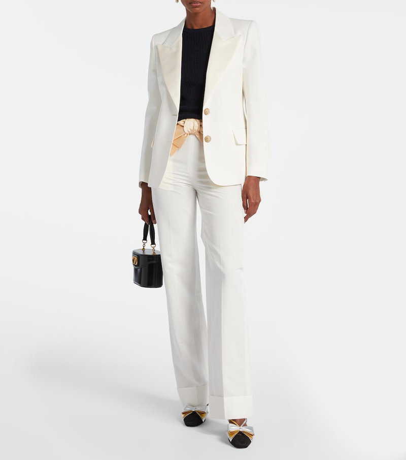 Valentino cream-colored blazer and matching trousers outfit.