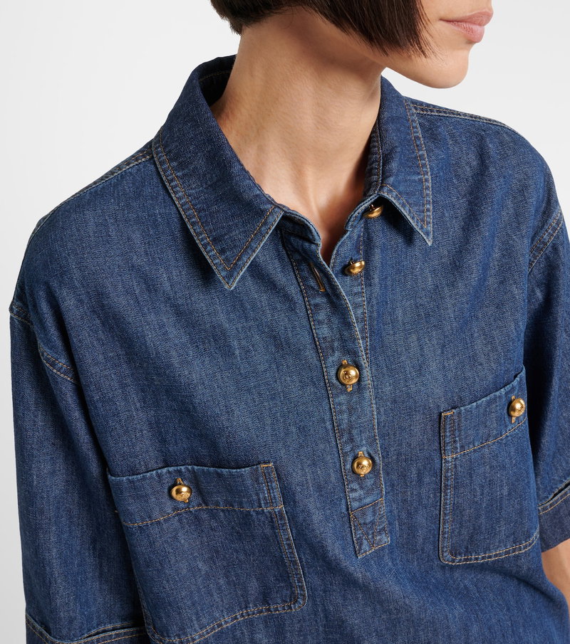 Blue denim shirt with gold buttons and pockets