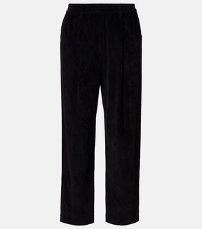 Black corduroy trousers with pleats and a drawstring waist.