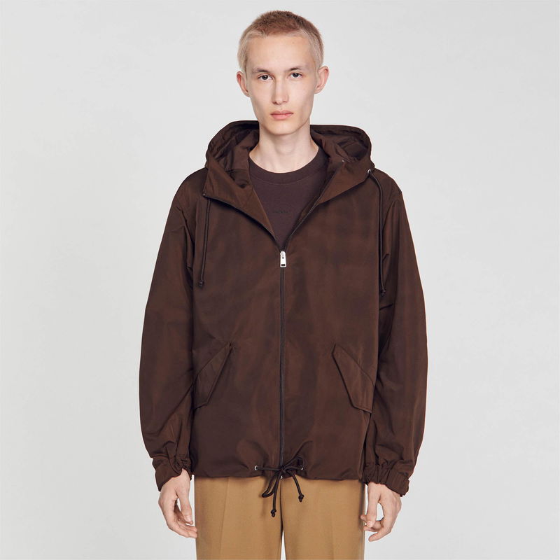Brown SANDRO hooded jacket worn by a man