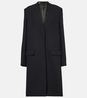 Black wool coat hanging on a hanger