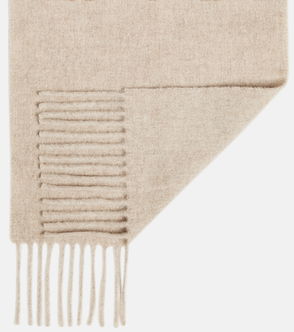 Beige ribbed wool scarf, folded.
