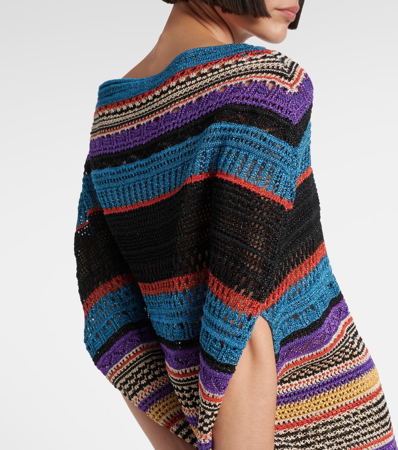 Colorful striped knitted shawl draped over a woman's shoulders
