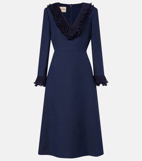 Navy dress with a ruffled neckline and pleated sleeves