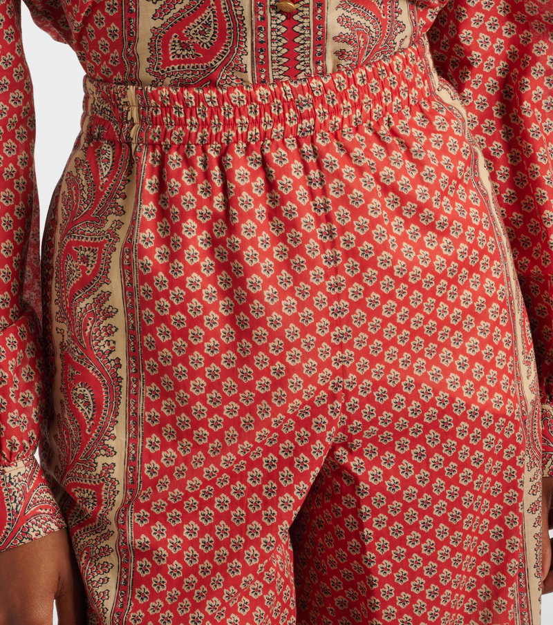 Red silk jumpsuit with paisley print