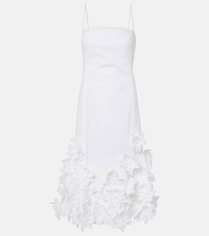 White slip dress with floral embellishment at the hem