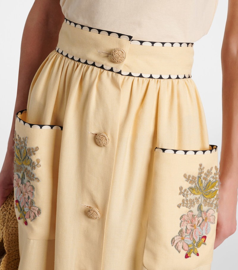 Valentino embroidered midi skirt in pale yellow with a woven belt and floral detailing.