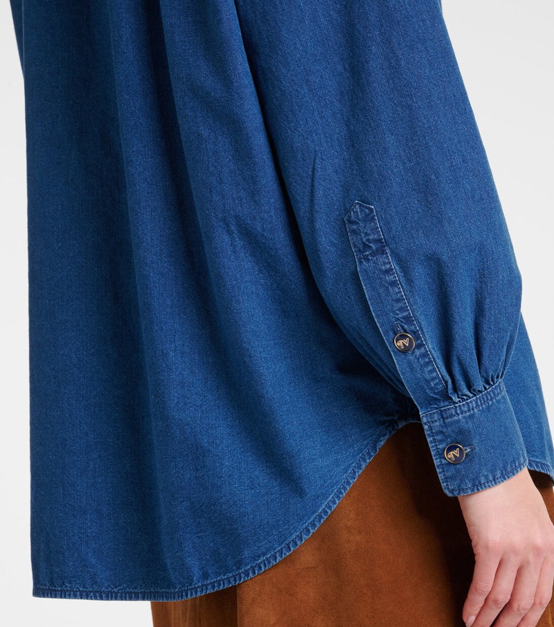 Blue denim shirt with rounded sleeves and button details