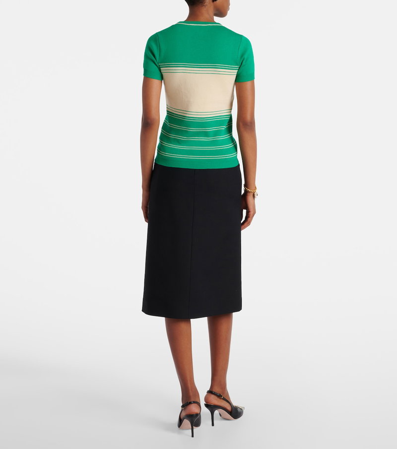 Valentino green and cream striped knit top with black pencil skirt.