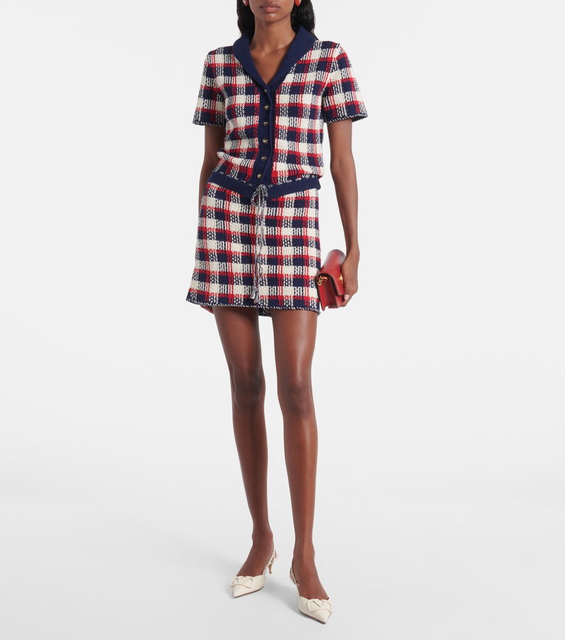 Valentino tweed skirt suit with a red, white, and blue check pattern.