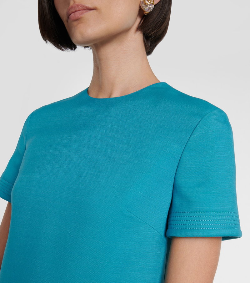 Valentino teal knit top with embellished earrings