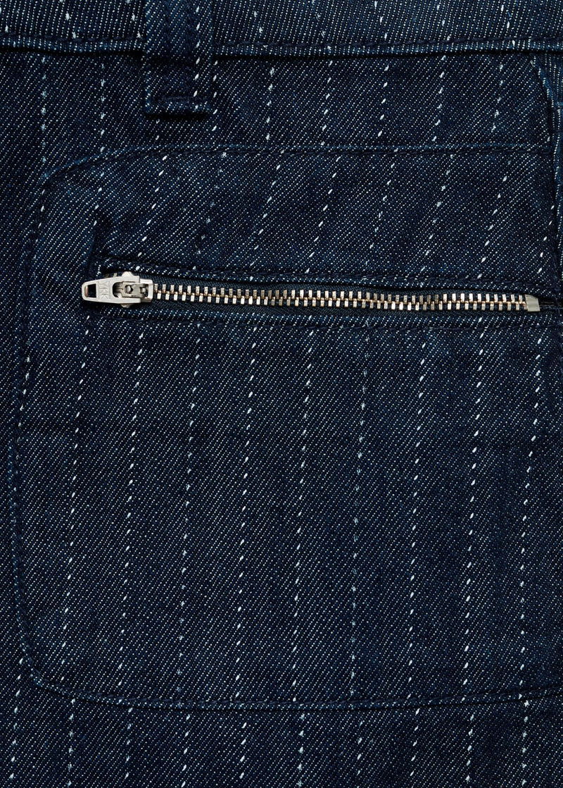 Dark wash denim jeans with white stitching and a zipper pocket.