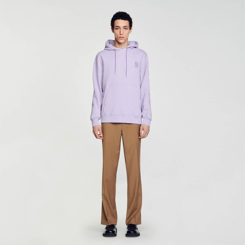 Lavender hooded sweatshirt with embroidered logo, worn by a man.