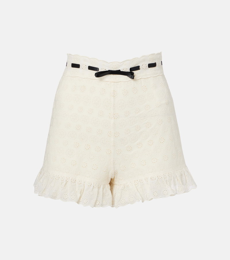 Off-white shorts with scalloped lace detailing and a black ribbon belt.