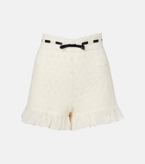 Off-white shorts with scalloped lace detailing and a black ribbon belt.