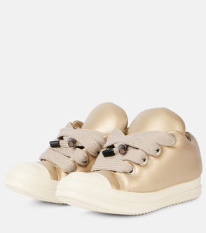 Gold satin sneakers with oversized, knotted laces.