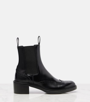 Black leather Chelsea boots with broguing